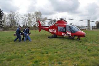 Practicing Loading a Patient On a Air Ambulance